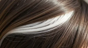 is a white streak in hair a blessing or a warning